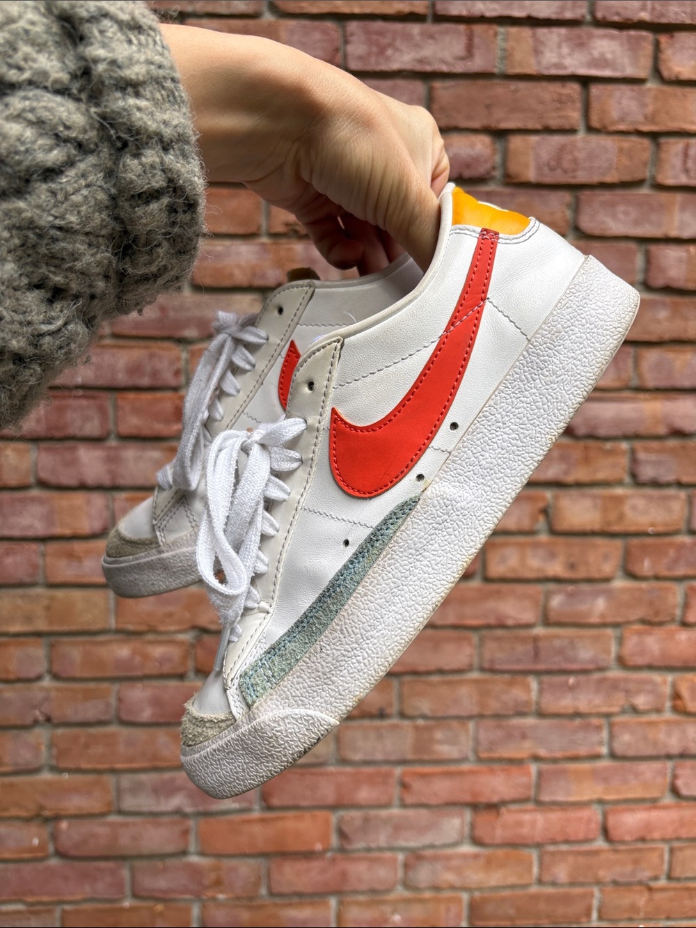 Nike White Sneakers with Red Swoosh and Yellow Heel